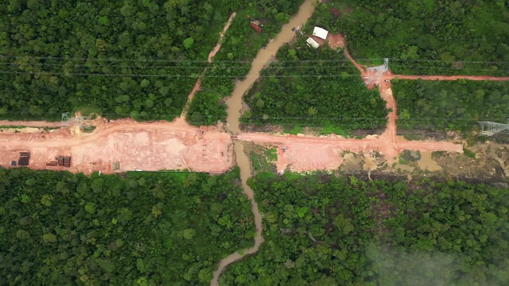 Construction of Avenida Liberdade highway cutting through the Amazon rainforest