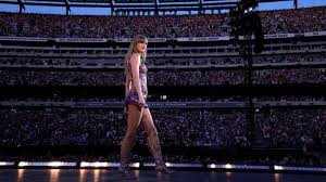 Taylor Swift performing on elaborate stage during Eras Tour