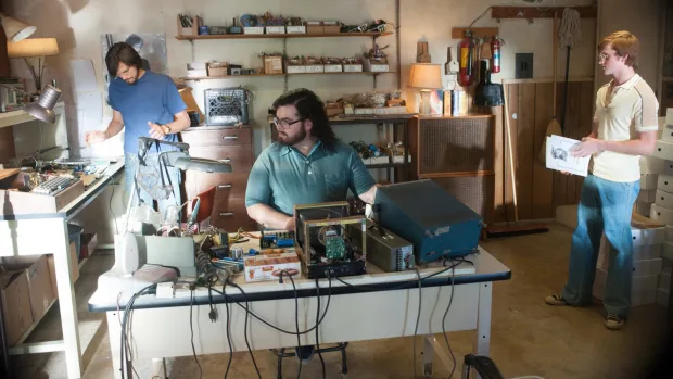 Steve Jobs and Steve Wozniak working in Apple's original garage